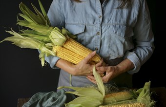 Close up of Caucasian woman holding corn