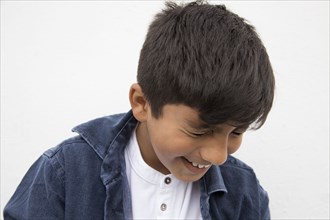 Close up of Asian boy laughing