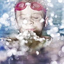 Caucasian girl swimming in water