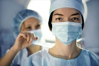 Caucasian surgeon wearing mask in operating room