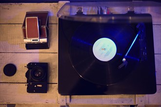 Close up of record player and vintage cameras