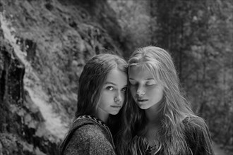 Caucasian teenage girls in forest