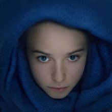 Caucasian teenage girl wrapped in scarf