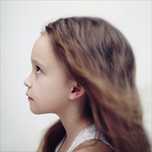 Profile of Caucasian girl looking up