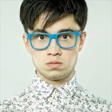Caucasian man wearing colorful eyeglasses