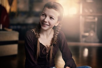 Caucasian teenage girl smiling indoors