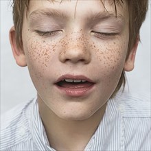Close up of Caucasian boy with freckles