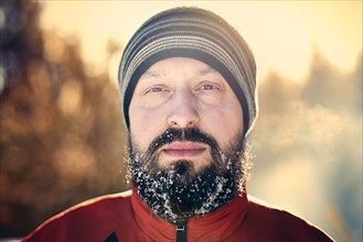 Caucasian man with snow in beard