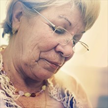 Close up of older Caucasian woman looking down