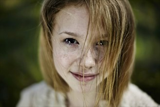 Smiling Caucasian girl with freckles