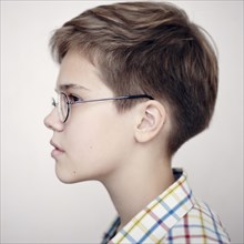 Profile of Caucasian boy wearing eyeglasses