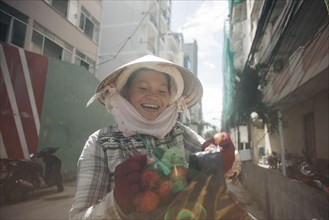 Vietnamese woman smiling in street