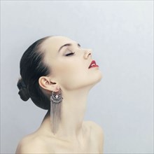 Portrait of Caucasian woman wearing earrings