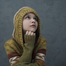 Pensive Caucasian girl wearing hood