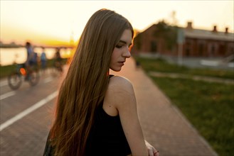 Pensive Caucasian woman at waterfront