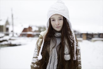 Portrait of Caucasian girl outdoors in snow