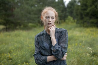 Portrait of Caucasian girl standing in field