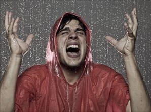 Caucasian man caught in the rain