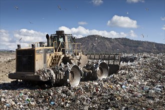 Machinery working in landfill