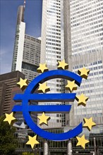Euro symbol on city street