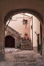 Stone archway to courtyard and steps