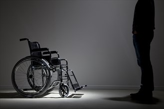 Caucasian man approaching wheelchair