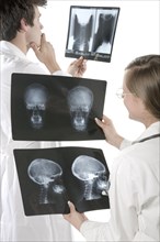 Doctors examining x-rays in hospital