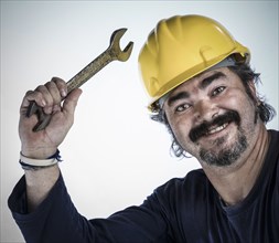 Construction worker holding wrench