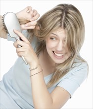 Woman brushing her hair