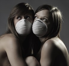 Naked Caucasian women wearing pollution mask