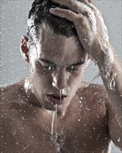 Caucasian man showering