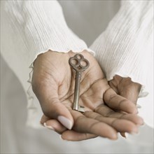 Close up of hands holding key