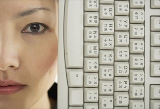 Close up portrait of woman with keyboard