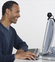 Profile of man working on computer