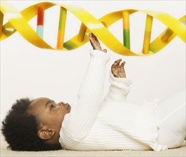 Baby playing with a DNA strand