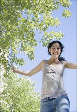 Young woman jumping for joy