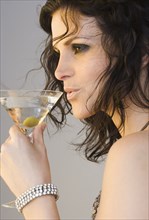 Woman drinking martini