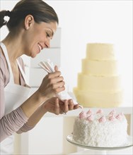 Woman icing a cake