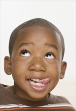 Close up of African boy sticking tongue out