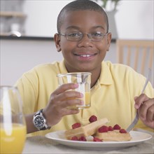 African boy eating breakfast
