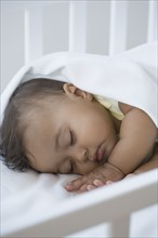 Close up of Hispanic baby sleeping