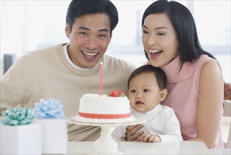 Asian family celebrating baby's first birthday