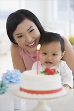 Asian mother celebrating baby's first birthday