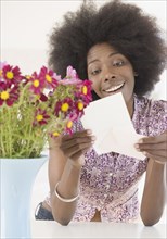 African woman receiving flowers