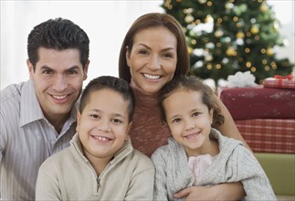 Portrait of Hispanic family on Christmas