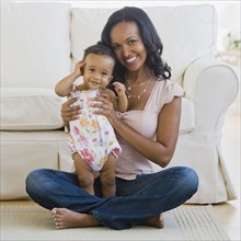 African American mother and baby on floor