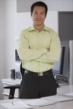 Asian businessman with arms crossed