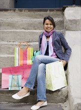 Mixed Race woman with shopping bags
