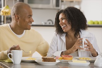 African couple eating breakfast