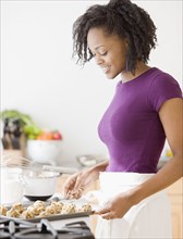 Africa woman baking cookies